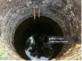 BODY OF WOMAN FOUND IN WELL